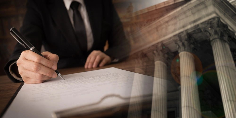 lawyer signing legal document and agreement with court background.