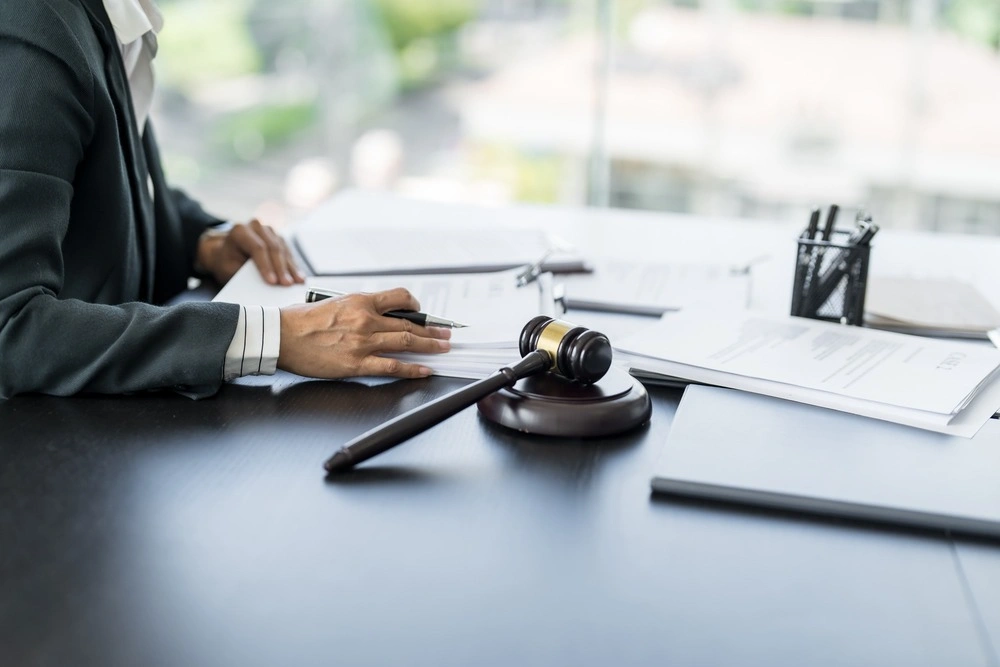 Lawyer businessman working with lawbook in office or courtroom Legal counsel with gavel and legal law.